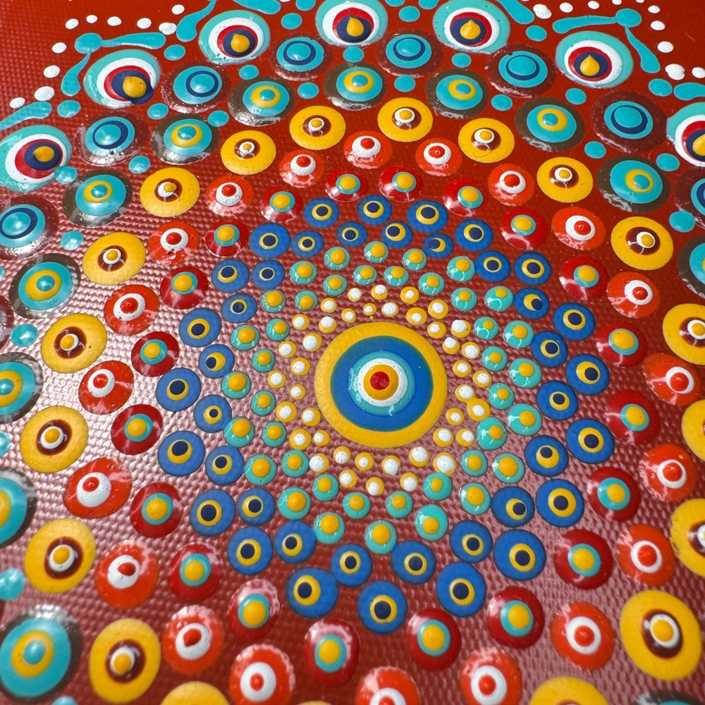 The mandala draws you in up close, which is perfect for a threshold space.